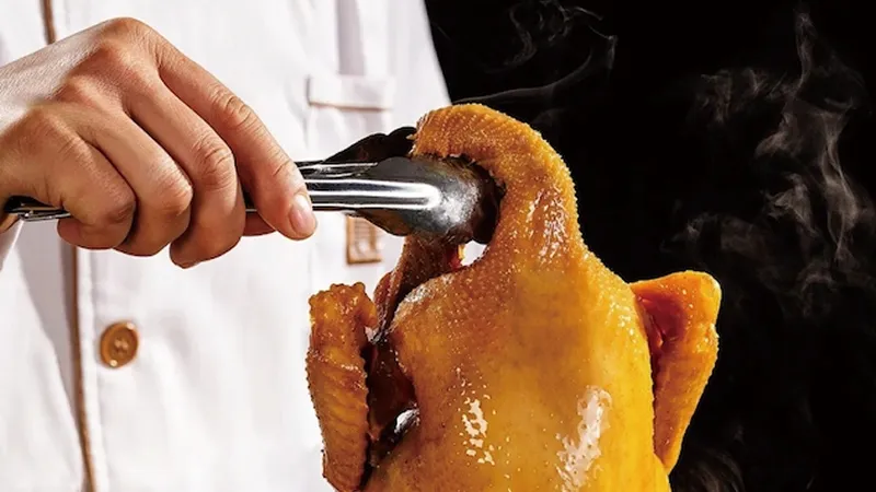 A chef preparing a braised duck dish